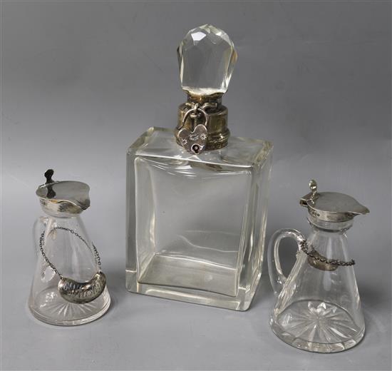 Two silver-mounted conical whisky noggins with spirit labels and a decanter,